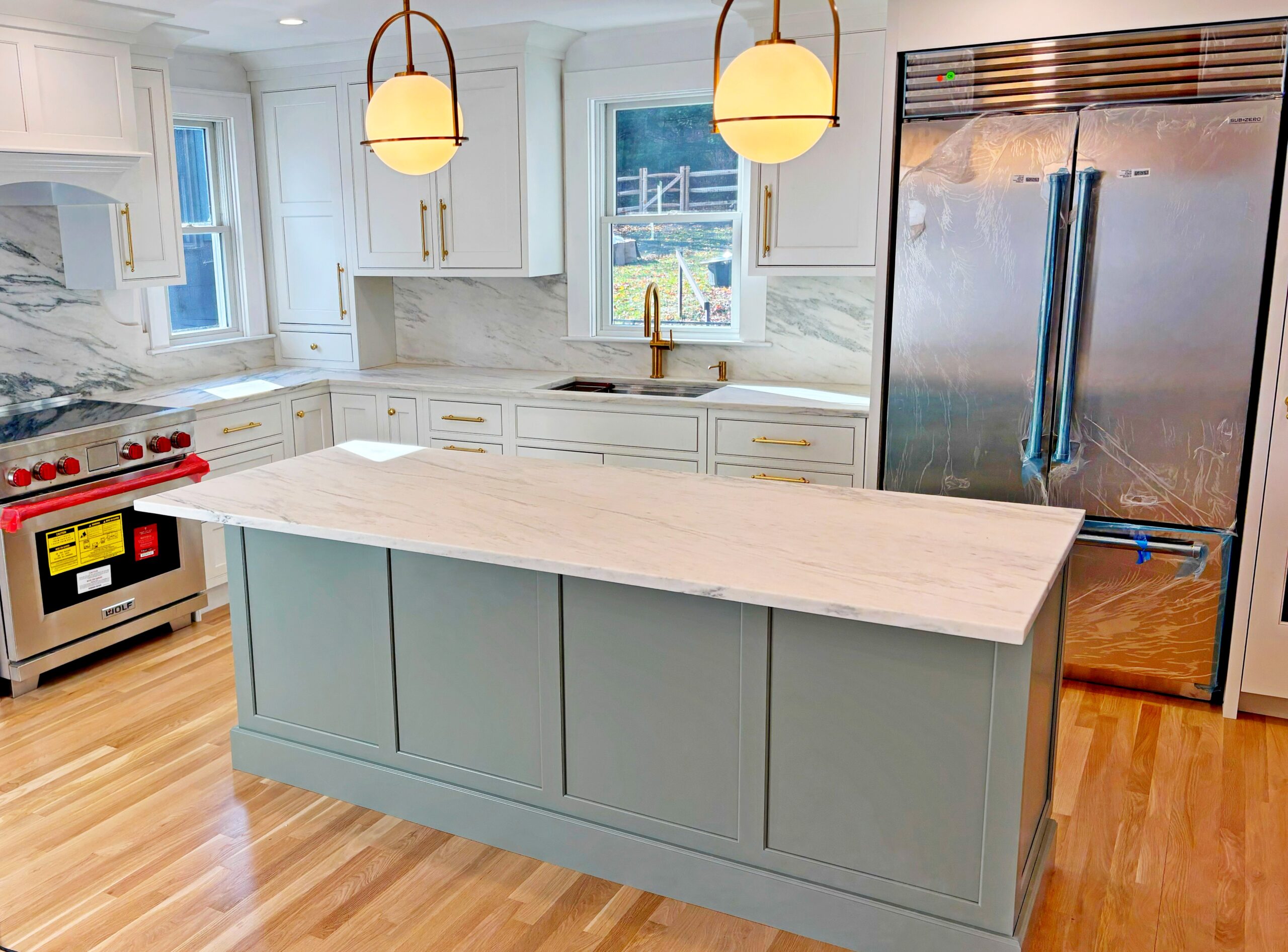 Finished kitchen remodel with custom cabinetry and countertops by KBK Woodworking